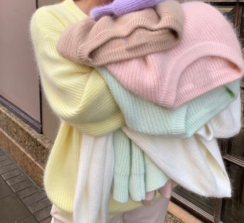 Stylish beige women's knit sweater, a comfortable long-sleeve top for elegant winter wear and cozy comfort.