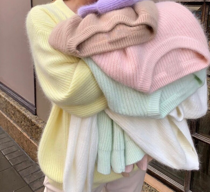 Stylish beige women's knit sweater, a comfortable long-sleeve top for elegant winter wear and cozy comfort.