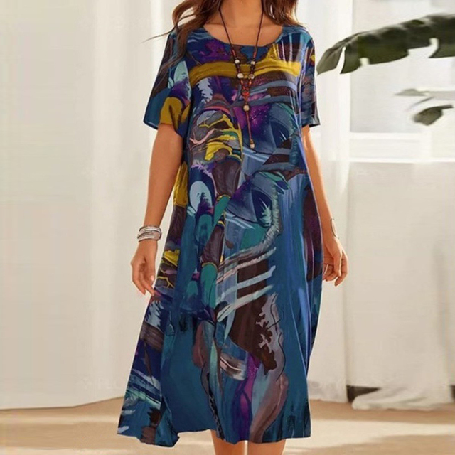 Women's effortless printed midi dress with artistic bohemian print, round neck, and relaxed fit, perfect for summer.