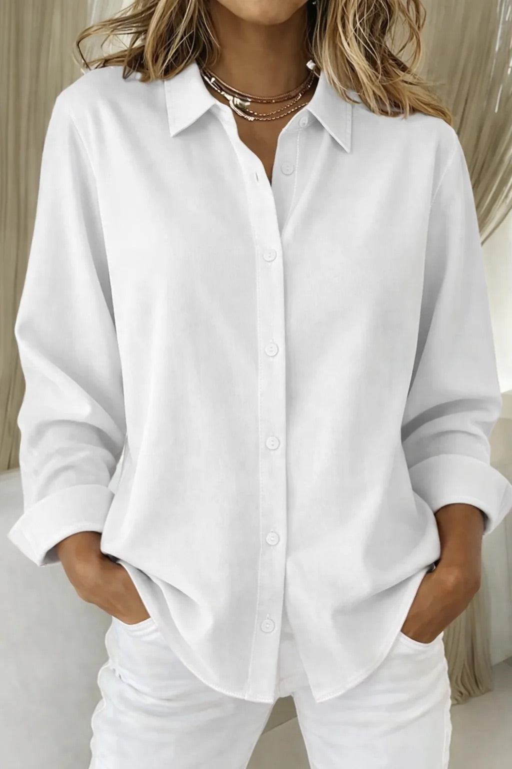 Relaxed fit women's button blouse with long sleeves, perfect for comfortable everyday style or office fashion.