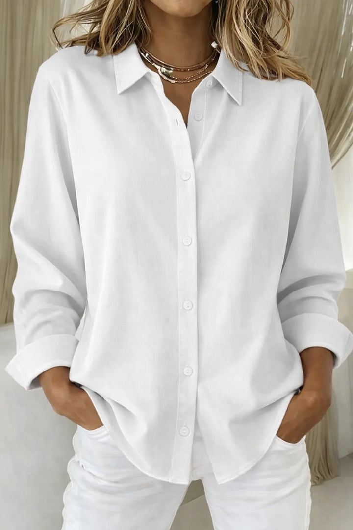 Relaxed fit women's button blouse with long sleeves, perfect for comfortable everyday style or office fashion.