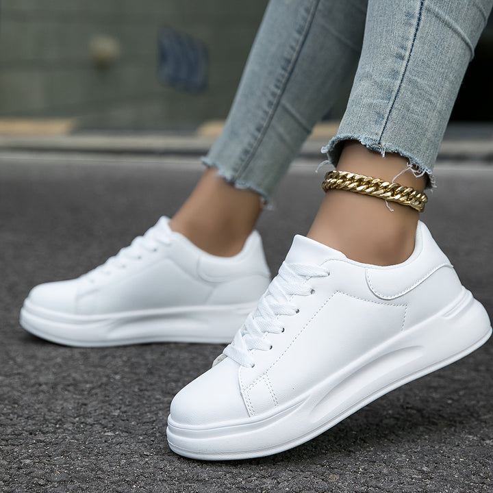 Supportive lace-up women's trainers with arch support and cushioning for comfort.