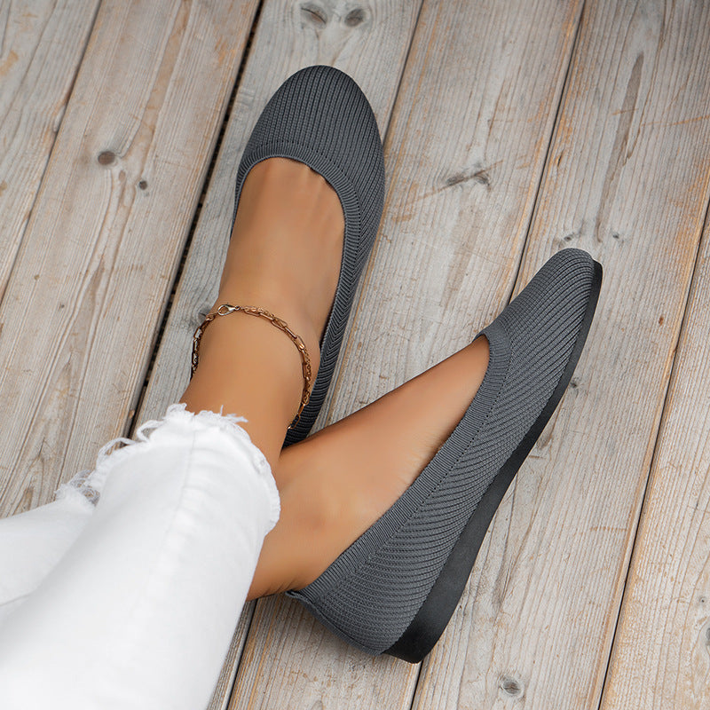 Breathable women's walking shoes with orthopedic arch support and convenient slip-on style.