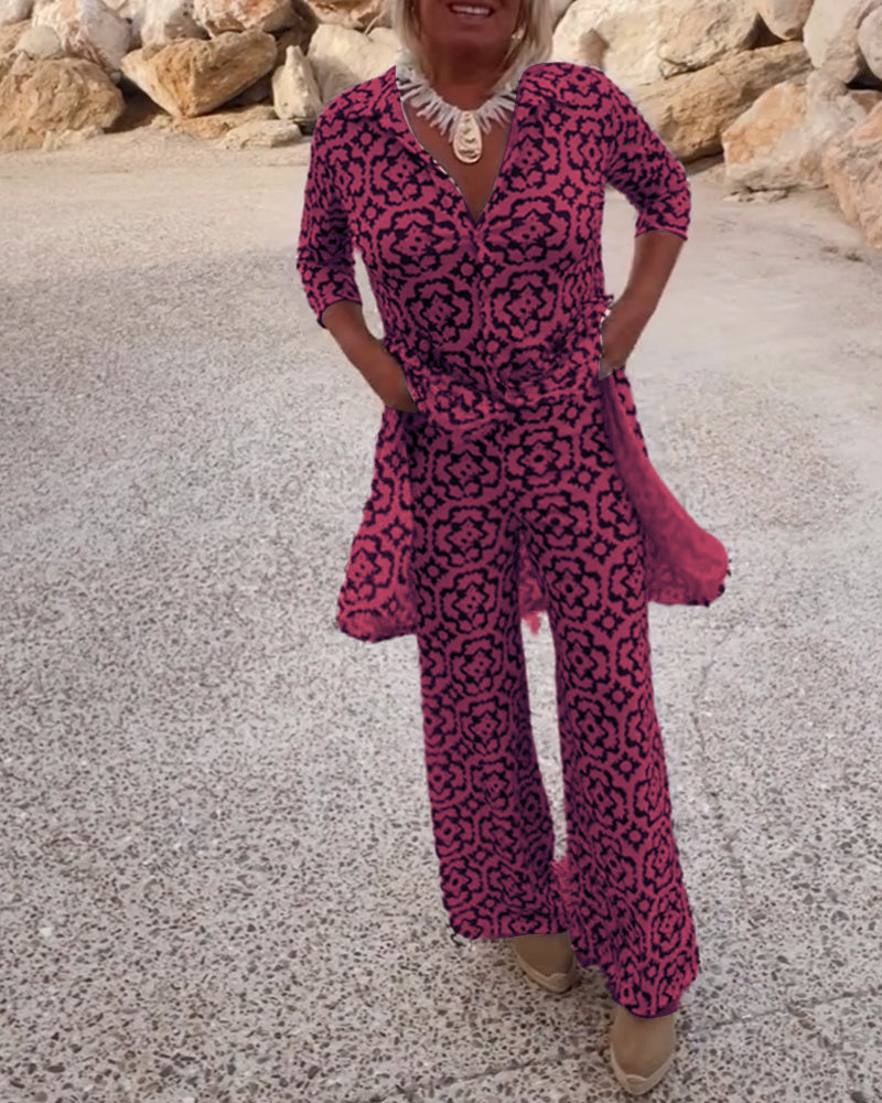 Women's printed V-neck tunic and wide-leg pants set. Comfortable, stylish two-piece outfit.