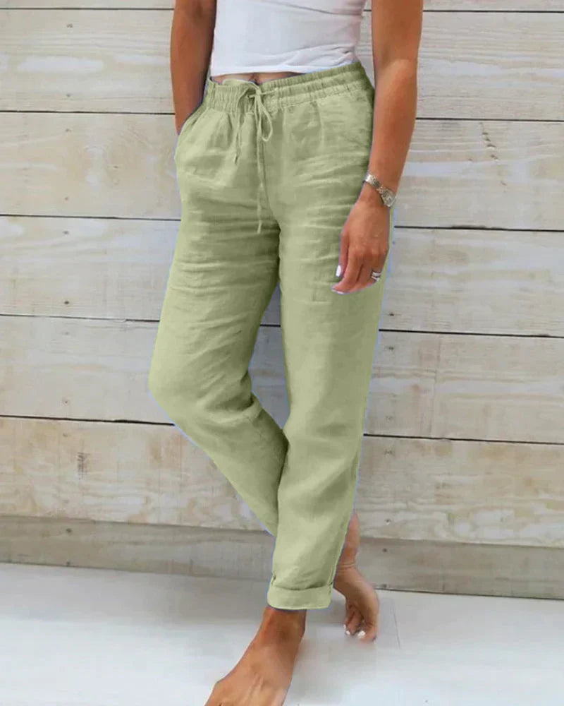 Women's relaxed fit drawstring trousers in light fabric, perfect for everyday comfort and casual summer style.