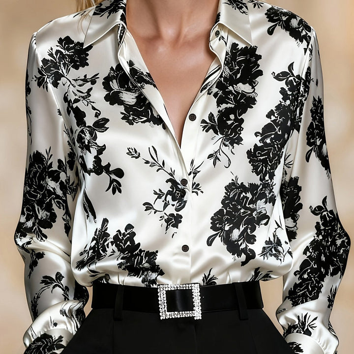 Women's elegant floral print long-sleeve blouse. Classic collar, button front. Versatile for spring fashion.