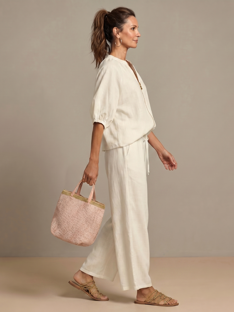 Relaxed fit wide-leg pants, offering comfortable wear in this two-piece women's set.