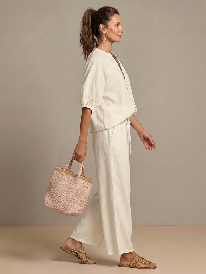 Relaxed fit wide-leg pants, offering comfortable wear in this two-piece women's set.