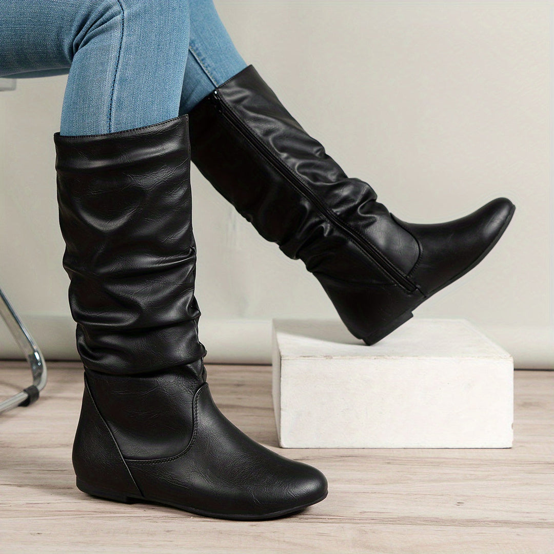 Red women's stylish gathered flat knee-high boots, a cozy and fashionable choice for winter style.