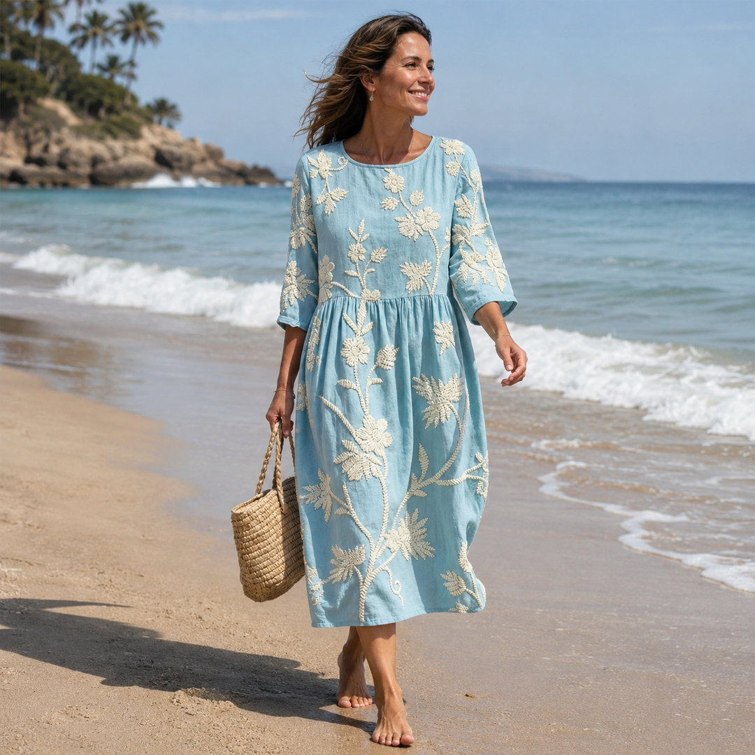 Vibrant floral print women's summer midi dress with comfortable round neck, ideal for warm weather.