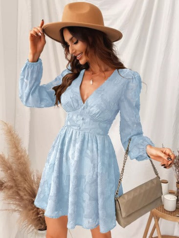 Trendy ladies' short dress, designed with elegant puff sleeves and a flattering V-neck, suitable for any special occasion.