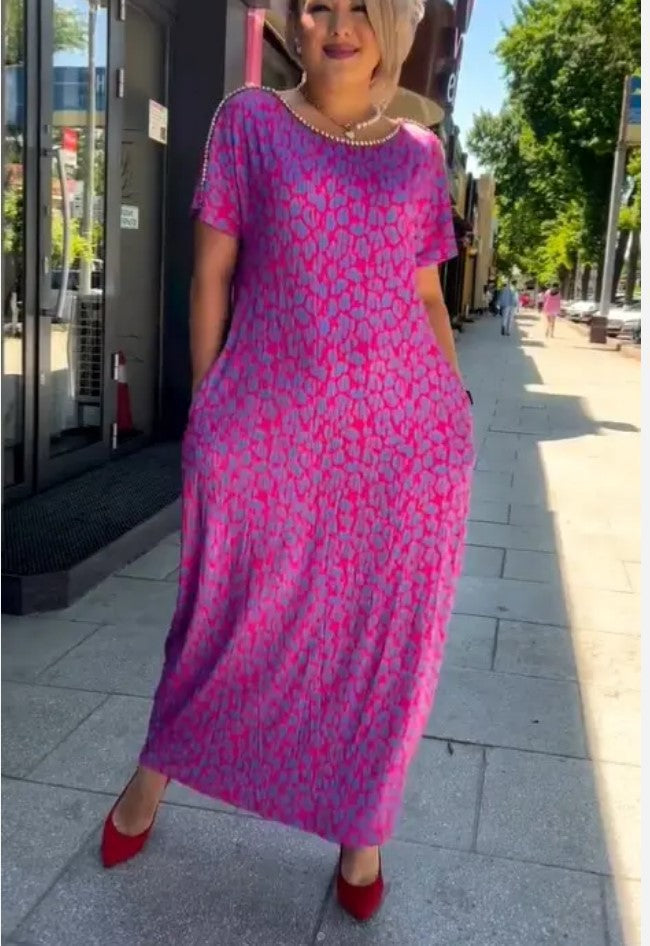 Stylish women's rose red floral A-line summer party dress. Elegant V-neck sleeveless design, perfect for any occasion.