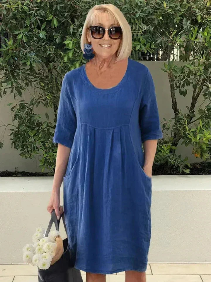 Versatile women's midi dress with a flattering loose fit & pockets, great for any casual occasion.