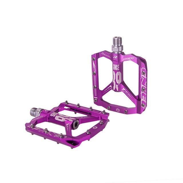 Robust unisex aluminum platform pedals, ultralight design with sealed bearings for durable mountain & road bike use.