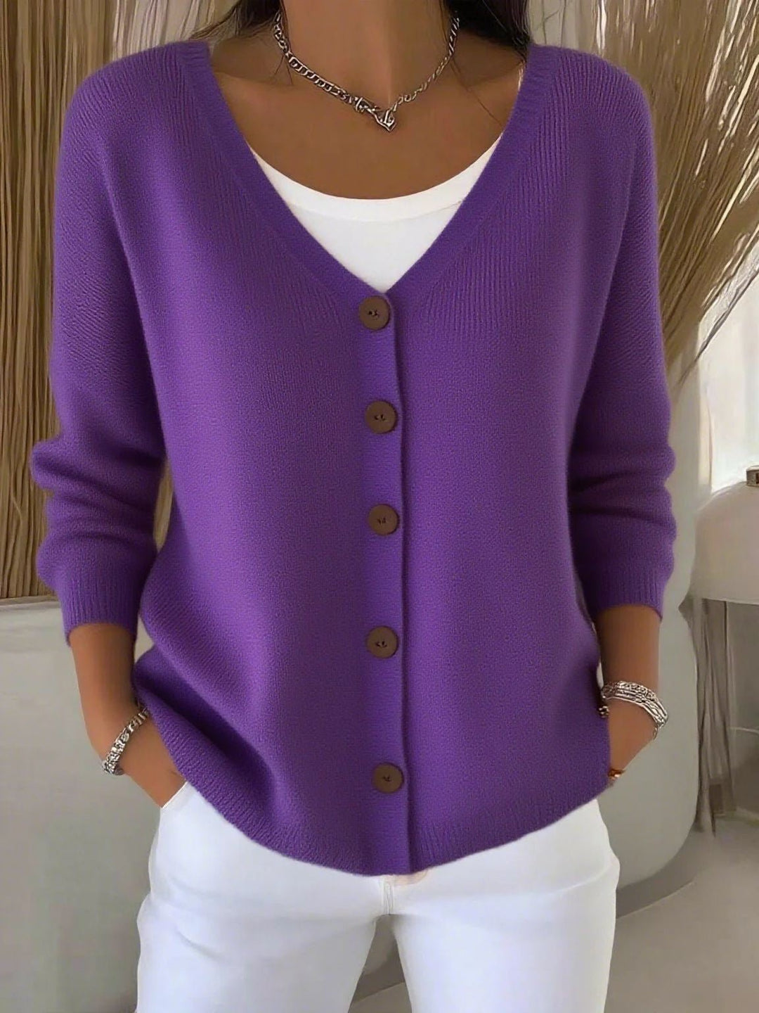 Effortless style with this women's V-neck button knit cardigan sweater, a comfortable long-sleeve top for any season.