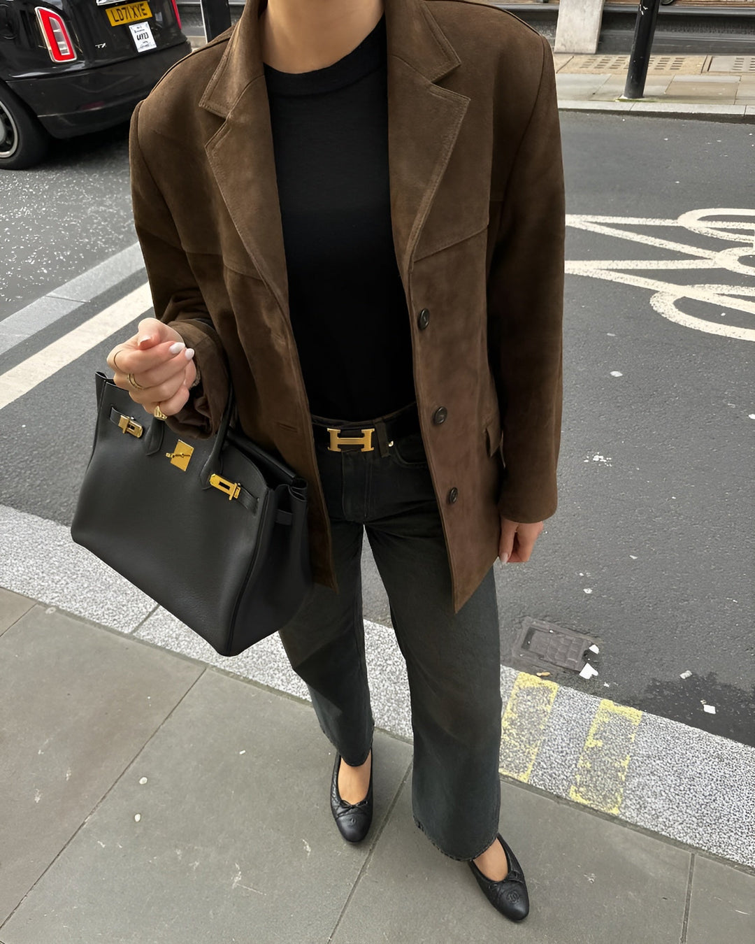 Polished women's one-button jacket, a must-have for versatile style and layering.