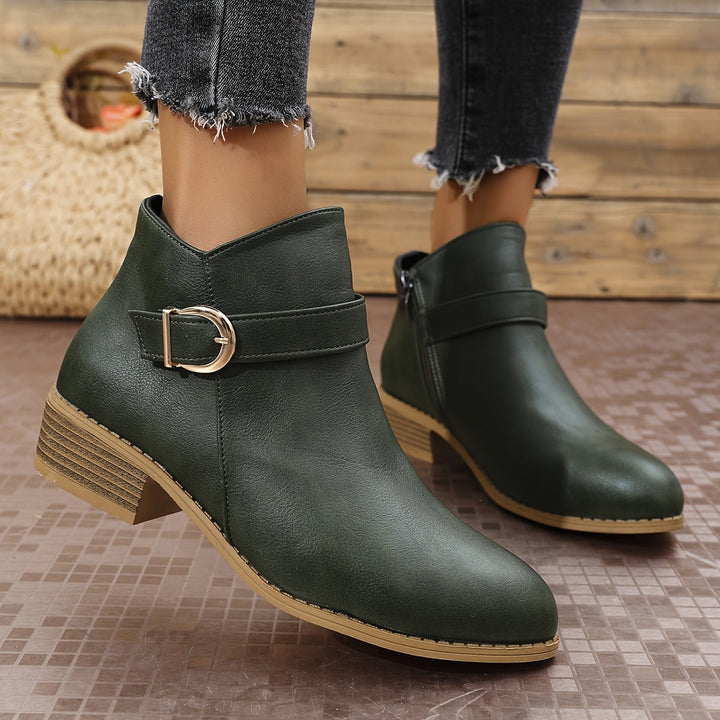 Women's brown Chelsea boots, ankle height, with a fashionable modern buckle, round toe, and everyday comfort.