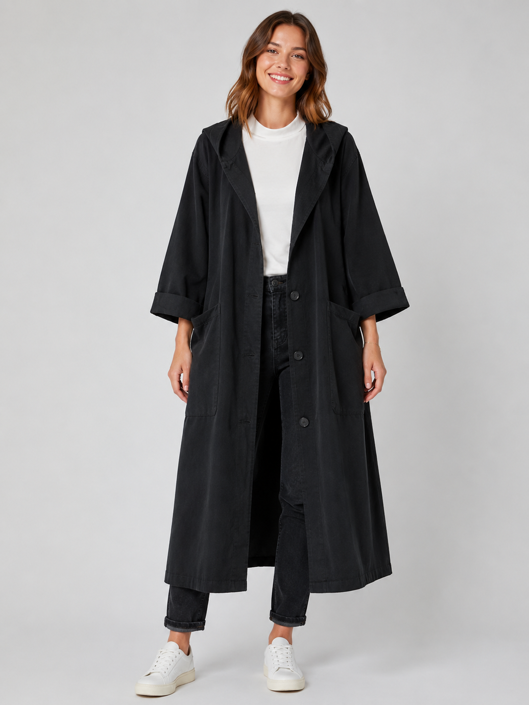 Elegant women's long trench coat with adjustable waist, offering a flattering and classic fit.