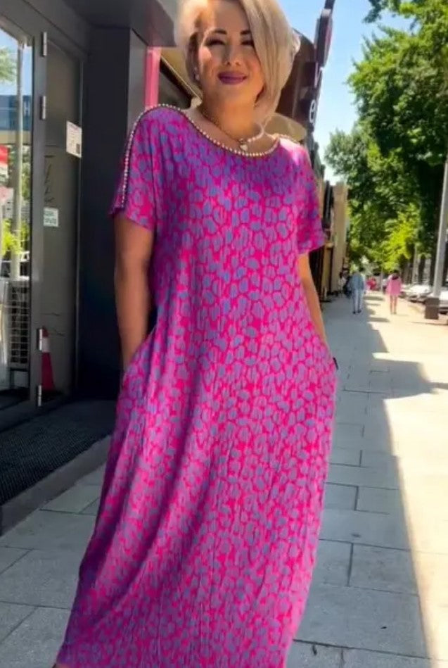 Elegant women's rose red floral A-line summer dress. V-neck, sleeveless, perfect for fashion-forward party or casual style.