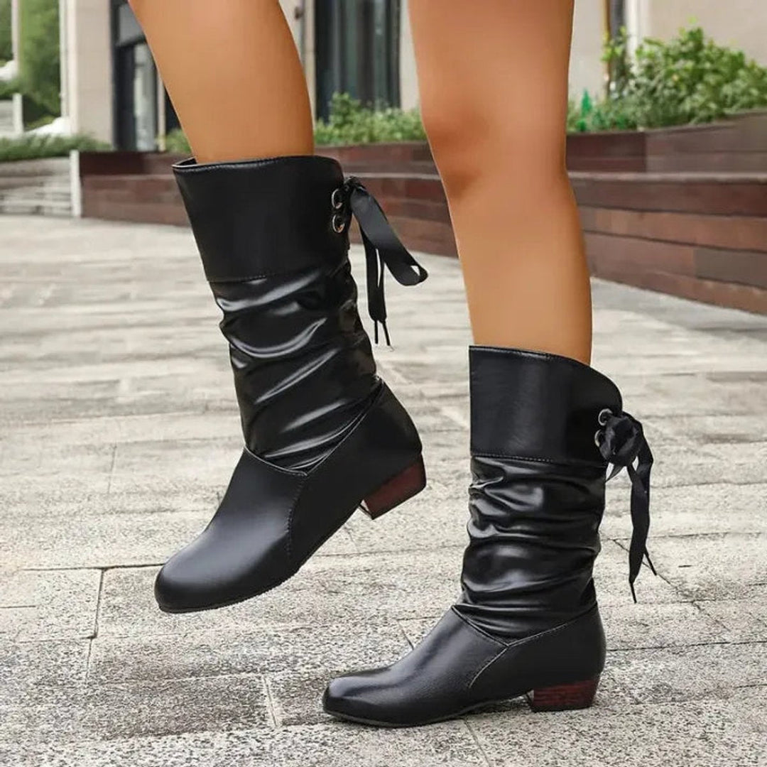 White women's versatile slouchy lace-up block heel ankle boots for any outfit.
