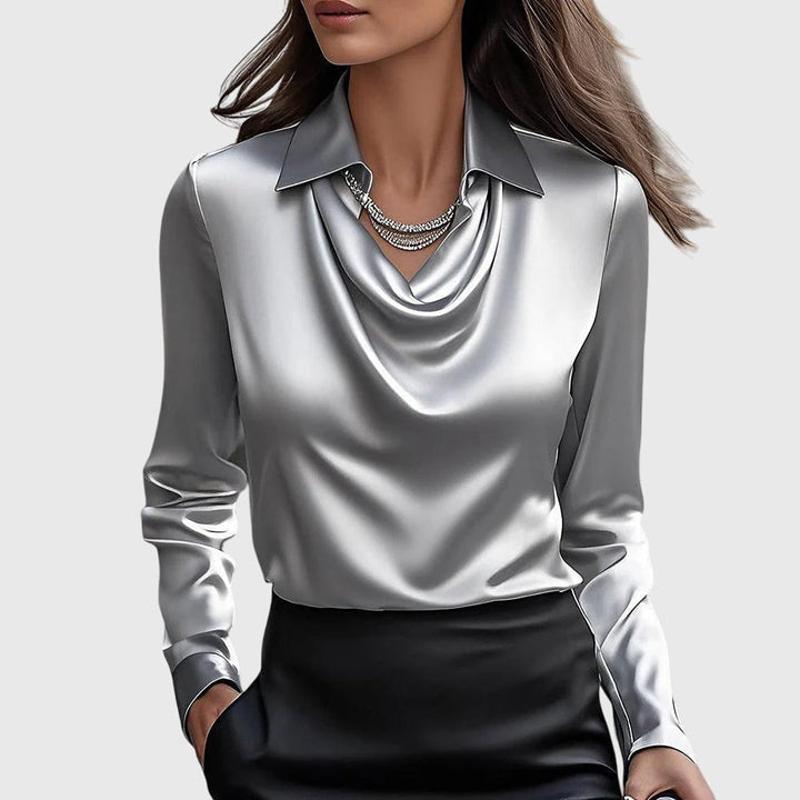 Chic women's top featuring a sophisticated pleated neckline and flowing fit. Versatile elegant blouse.
