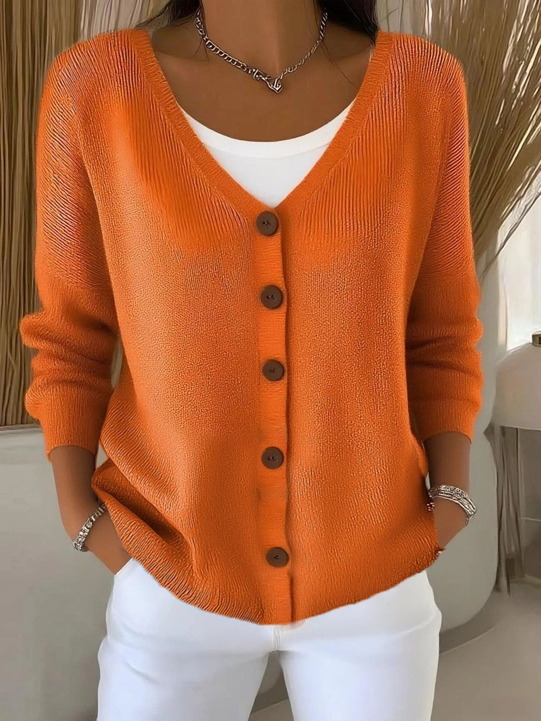 Women's V-neck button-front knit cardigan sweater, perfect for casual layering and everyday comfort.