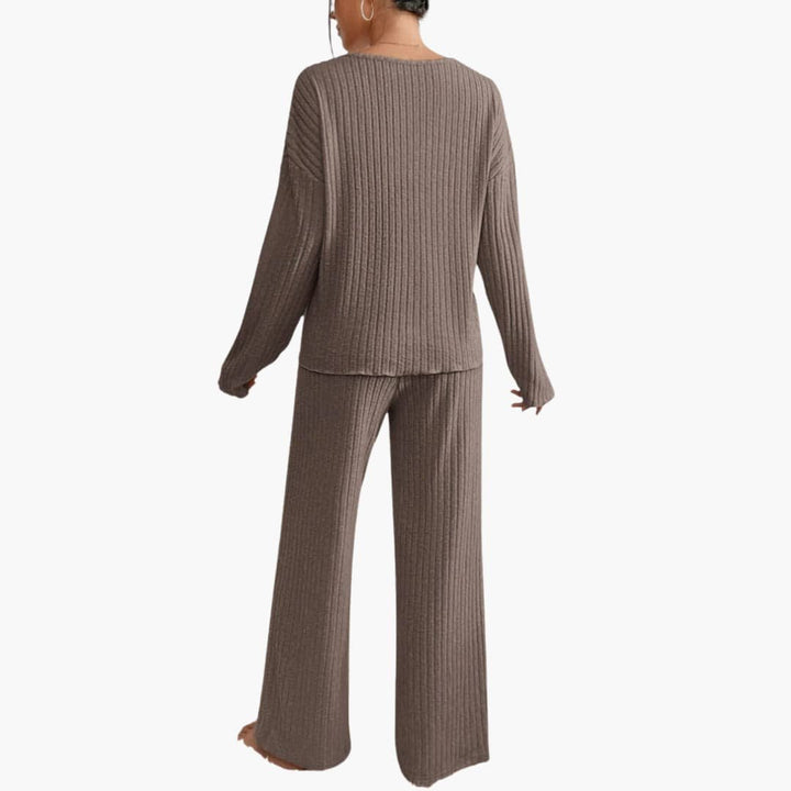 Stylish women's ribbed two-piece set for lounging. Elegant long sleeve top & straight leg pants.