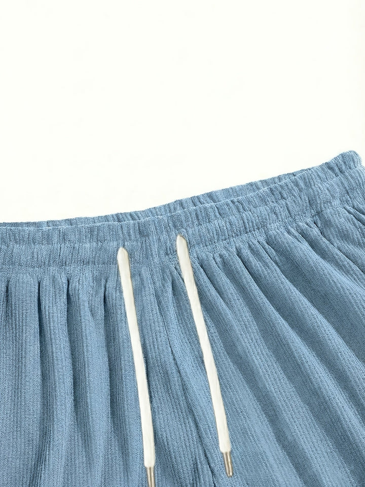 Ultra-comfortable men's black drawstring shorts, relaxed fit for all-day wear.