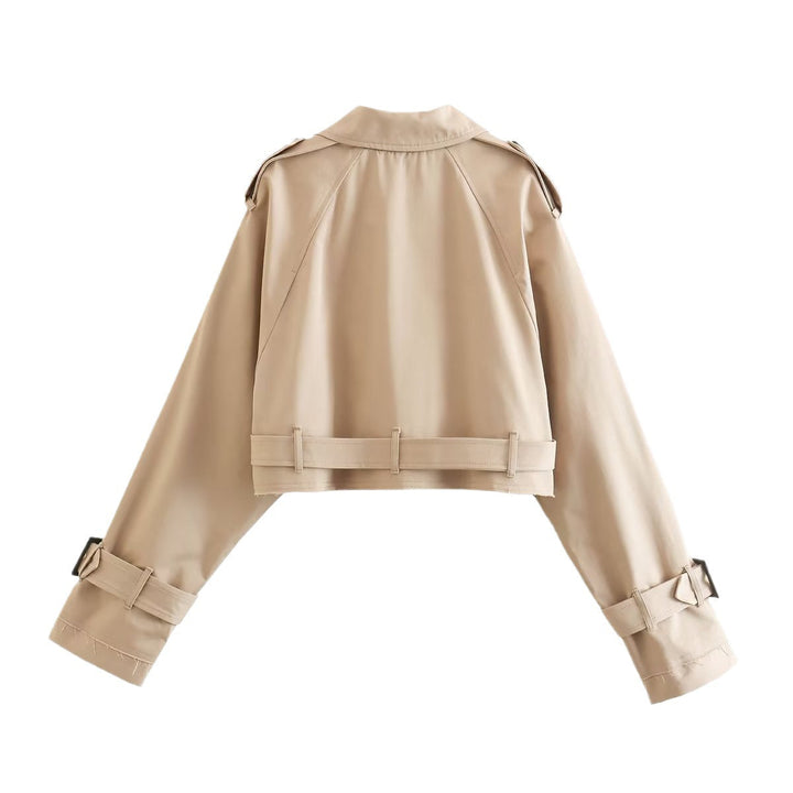 Modern women's cropped trench coat with belt, a versatile elegant jacket for office wear or casual chic city fashion.