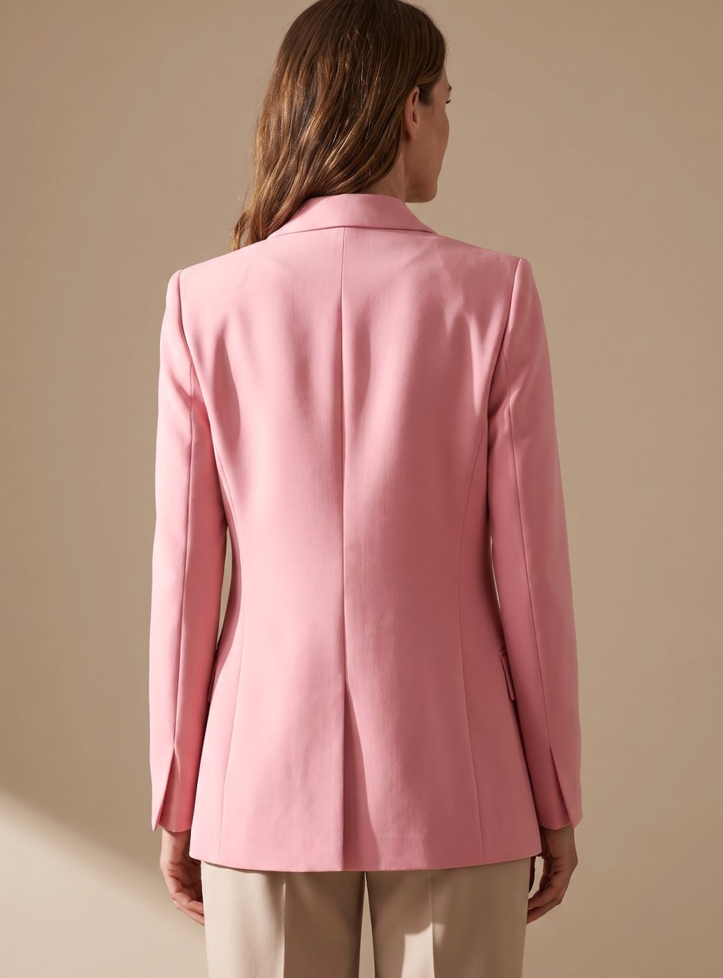 Elegant women's blazer and flared trousers two-piece set for professional wear, a sophisticated office attire.
