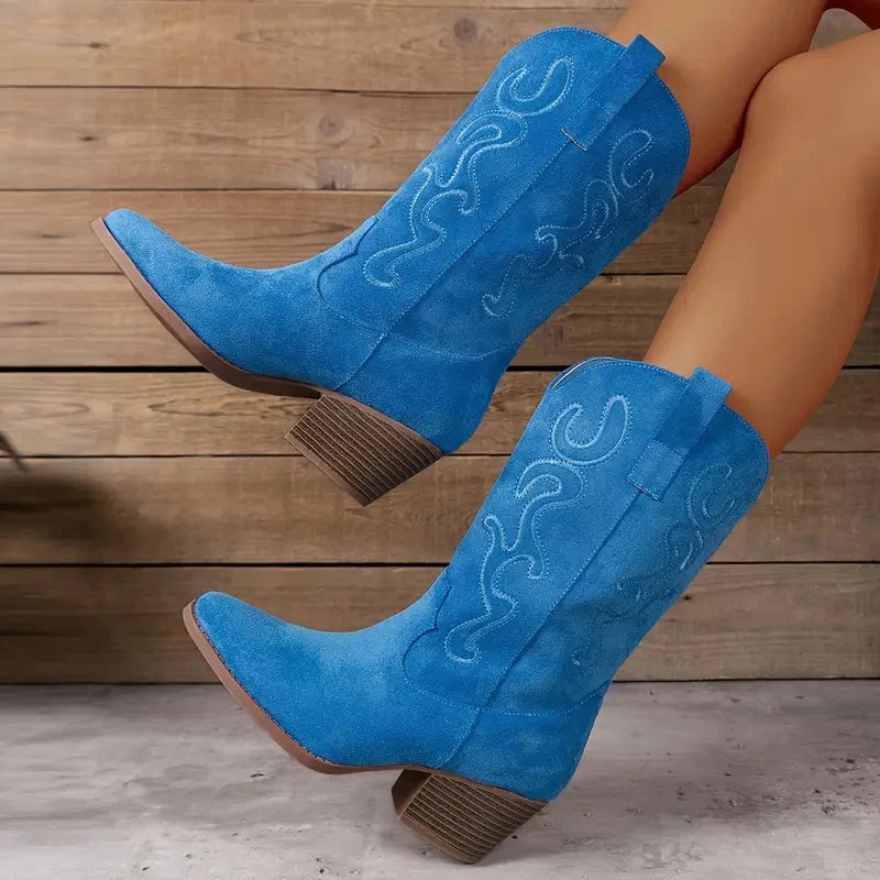 Bohemian-style women's ankle western boots featuring intricate stitch detail and comfortable block heel.