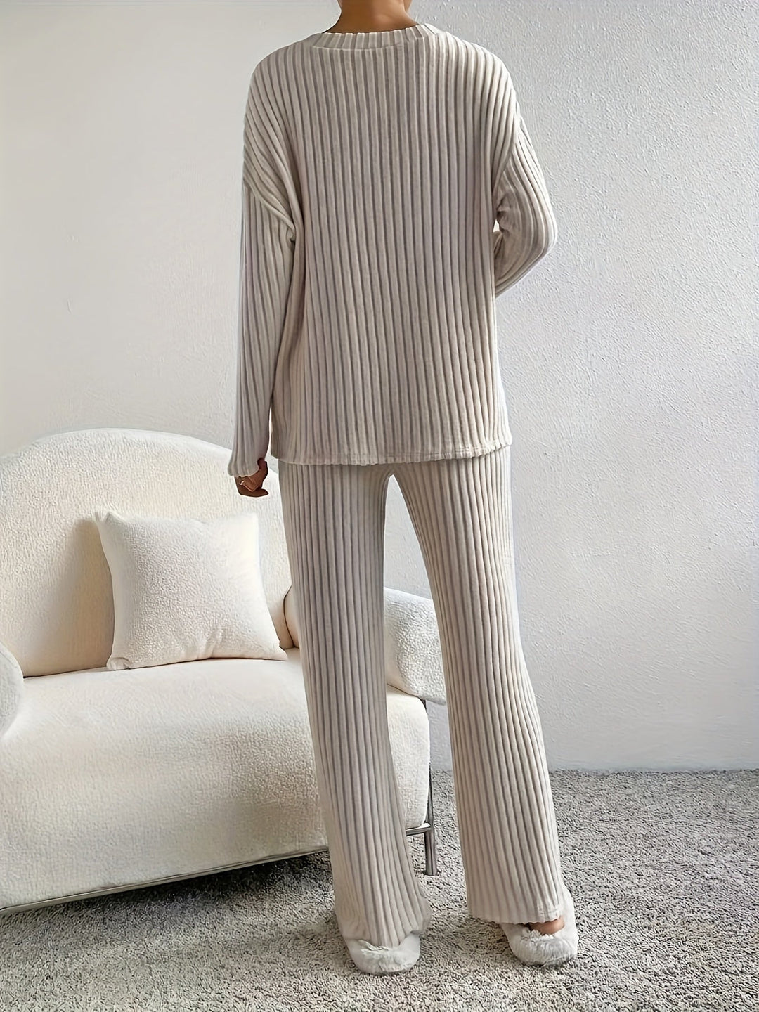 Relaxed fit women's two-piece set featuring a soft V-neck long-sleeve top & cozy pants, perfect for home.