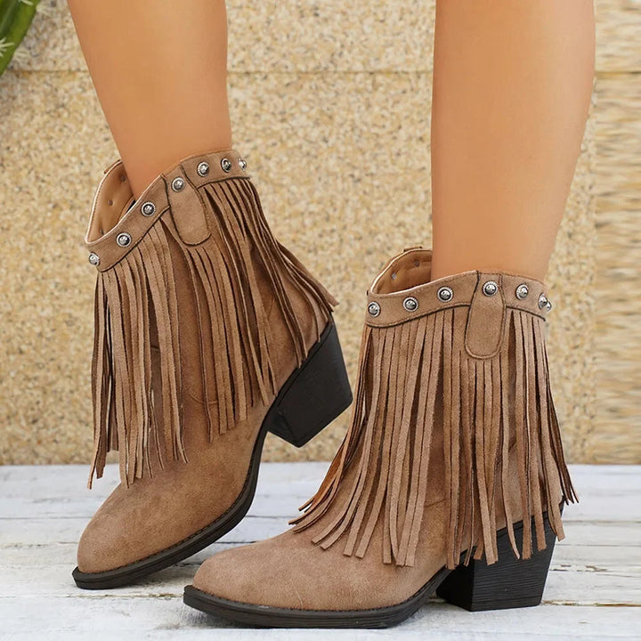 Comfortable women's wide-calf western fringe boots. Features side zipper & block heel for everyday casual style.