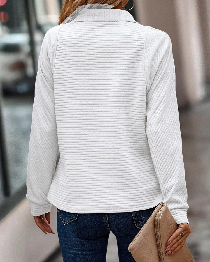Women's quarter-zip sweater with a cozy ribbed texture, perfect for relaxed casual outfits.