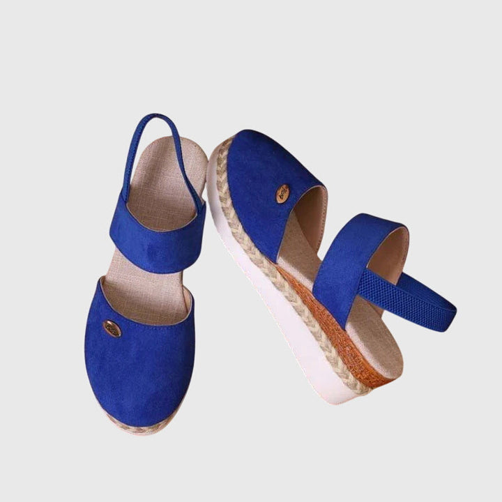 Women's orthopedic sandals featuring a responsive cushioned sole & essential arch support for comfort.