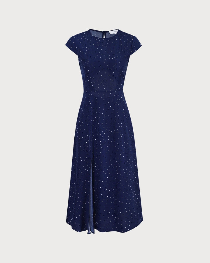 Summer-ready women's navy polka dot midi dress. Features a flattering cut-out design and comfortable A-line fit.