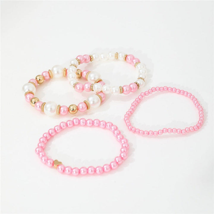 Stylish 4-piece women's bracelet set with faux pearls, heart beads. White layered fashion jewelry accessory.