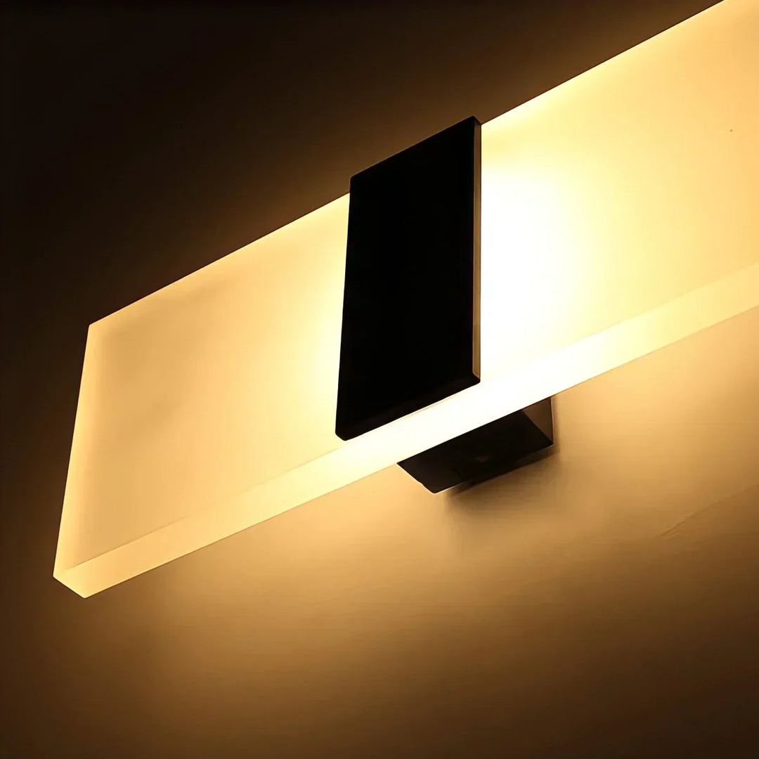 Modern rechargeable LED wall sconce with smart motion sensor for ambient indoor light and style.