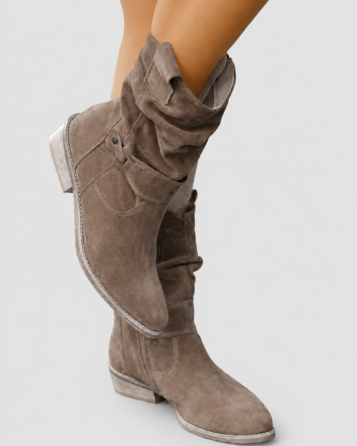 All-day comfort in elegant women's orthopedic low-heel ankle boots with practical side zip.