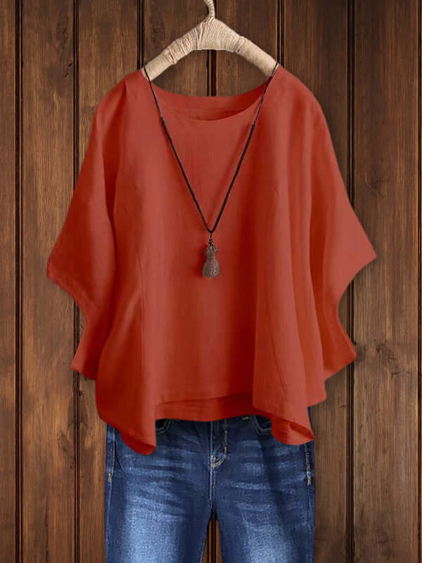 Summer fashion women's loose-fit tunic top. Crew neck and dolman sleeves offer comfortable, versatile everyday style.