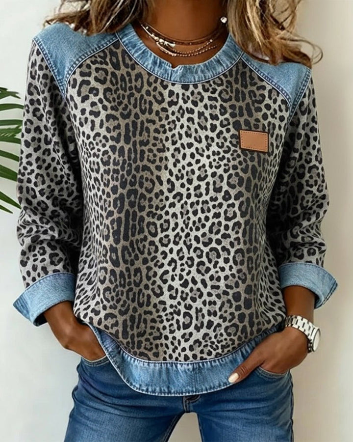 Trendy women's animal print knit sweater. Chic leopard pattern pullover, comfortable for fall and winter fashion.