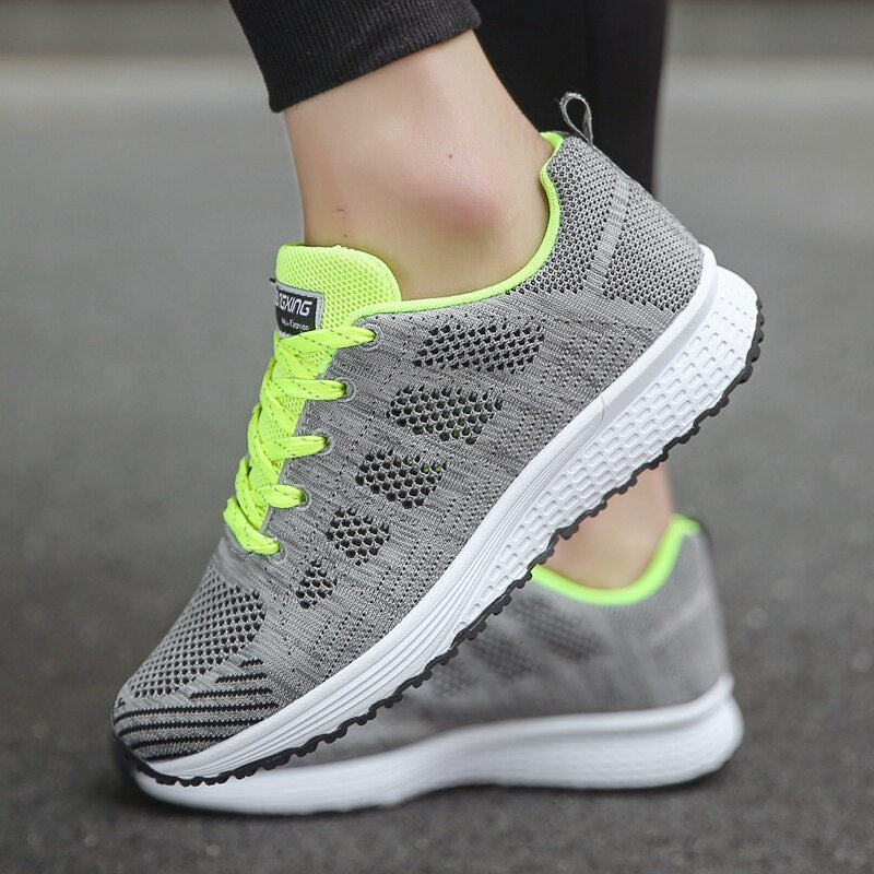 White women's orthopedic sneakers, perfect for walking & active lifestyles, offering breathable comfort.