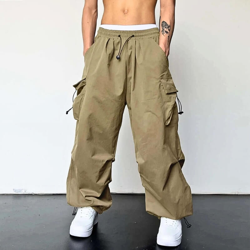 Unisex relaxed fit cargo joggers in black polyester, ultimate comfort for casual and streetwear style.