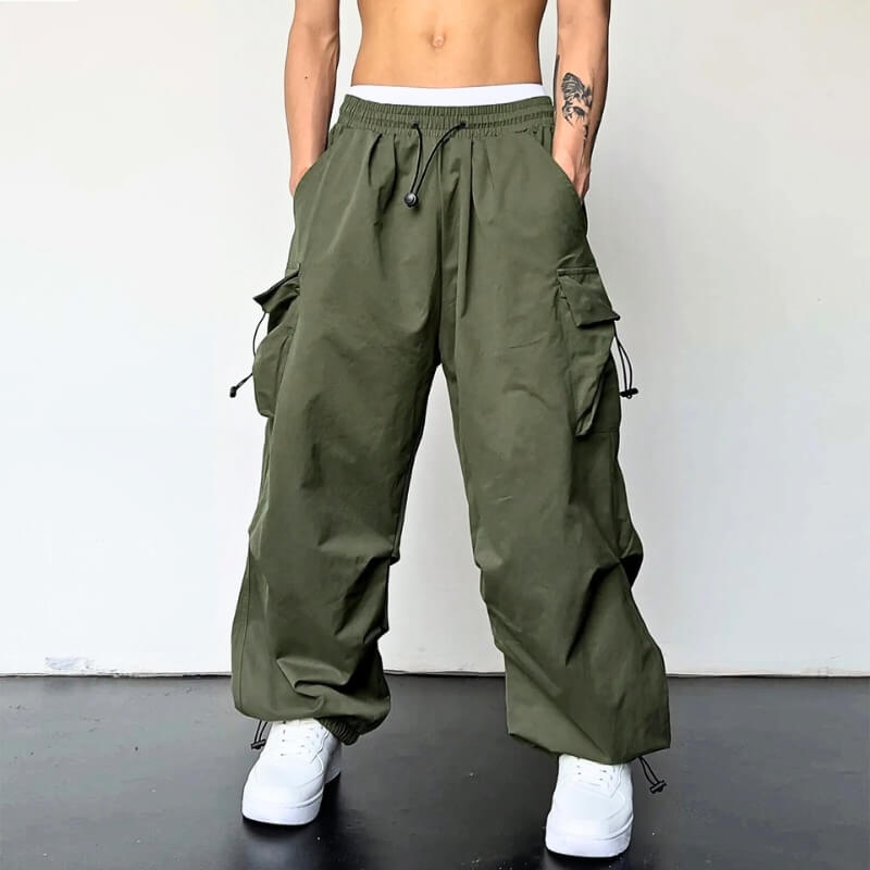 Relaxed fit polyester joggers with cargo pockets, offering supreme comfort and casual elegance.