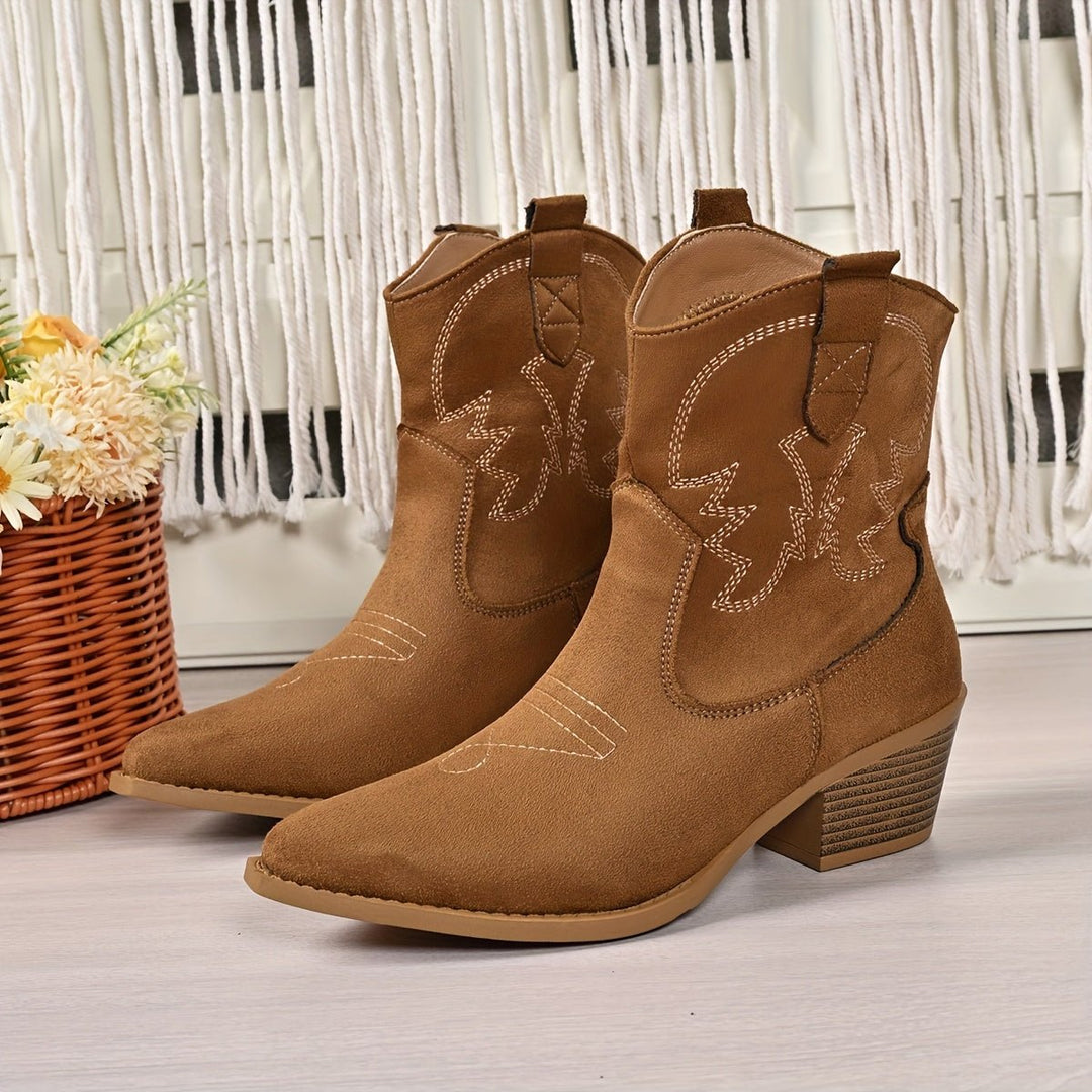 Women's wide-calf western cowboy boots, pull-on style, featuring detailed embroidery, pointed toe & block heel.