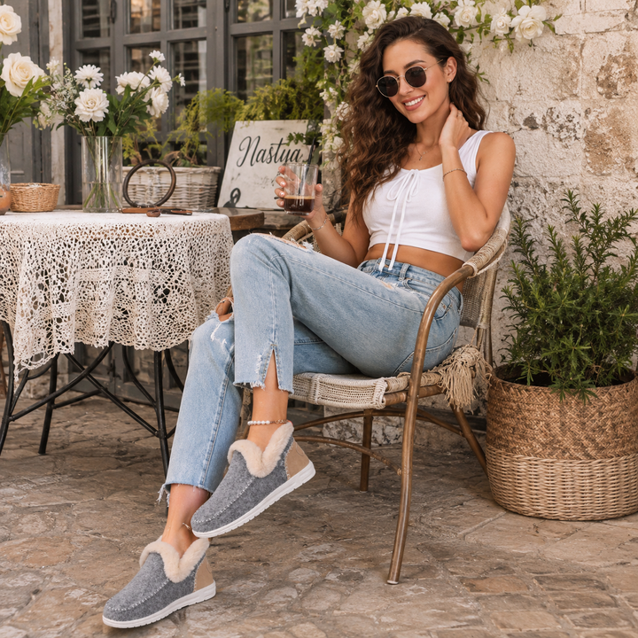 Women's cozy house slippers, providing orthopedic support and easy wear for loungewear.