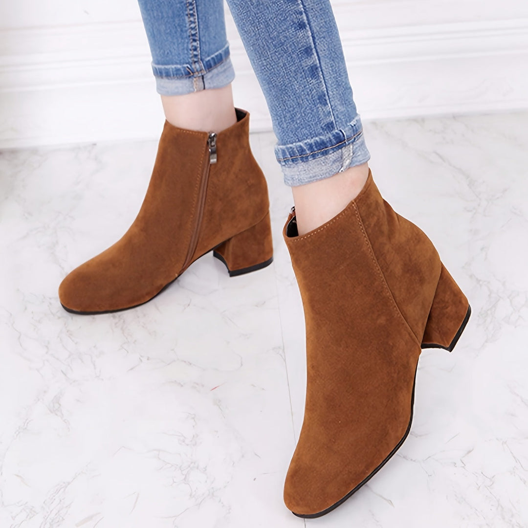 Women's stylish Chelsea ankle boots, featuring a comfortable & stable block heel. Ideal for fall & winter fashion.