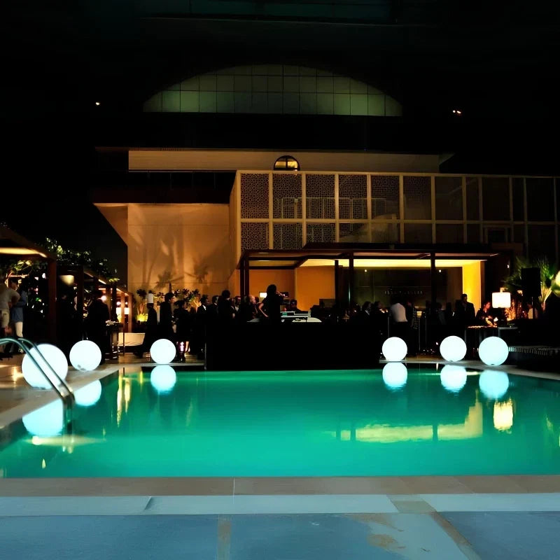 Daytime decor & nighttime RGB spherical light, weatherproof, remote for garden & patio lighting.