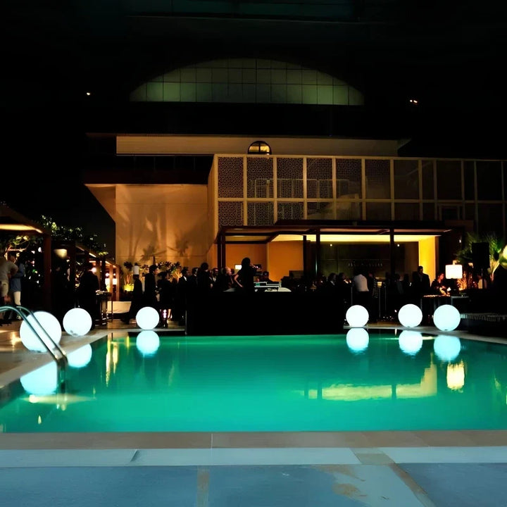 Daytime decor & nighttime RGB spherical light, weatherproof, remote for garden & patio lighting.