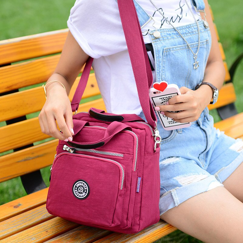 New women's water-resistant crossbody bag for everyday carry & travel. Multifunctional shoulder bag with secure compartments.